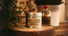 Load image into Gallery viewer, Cuban Tobacco &amp; French Oak - The Rhubarb Candle Company Soy Candle in  copper or silver Tin, Vegan, Cruelty free product. All the labels are vegan friendly. Long lasting candle made in our countryside kitchen in Dorset. Made in small batches and fully CLP compliant. Candles weight is approximately 200g and has a minimum burn time of 36 hours. Made by The Rhubarb Candle Company 